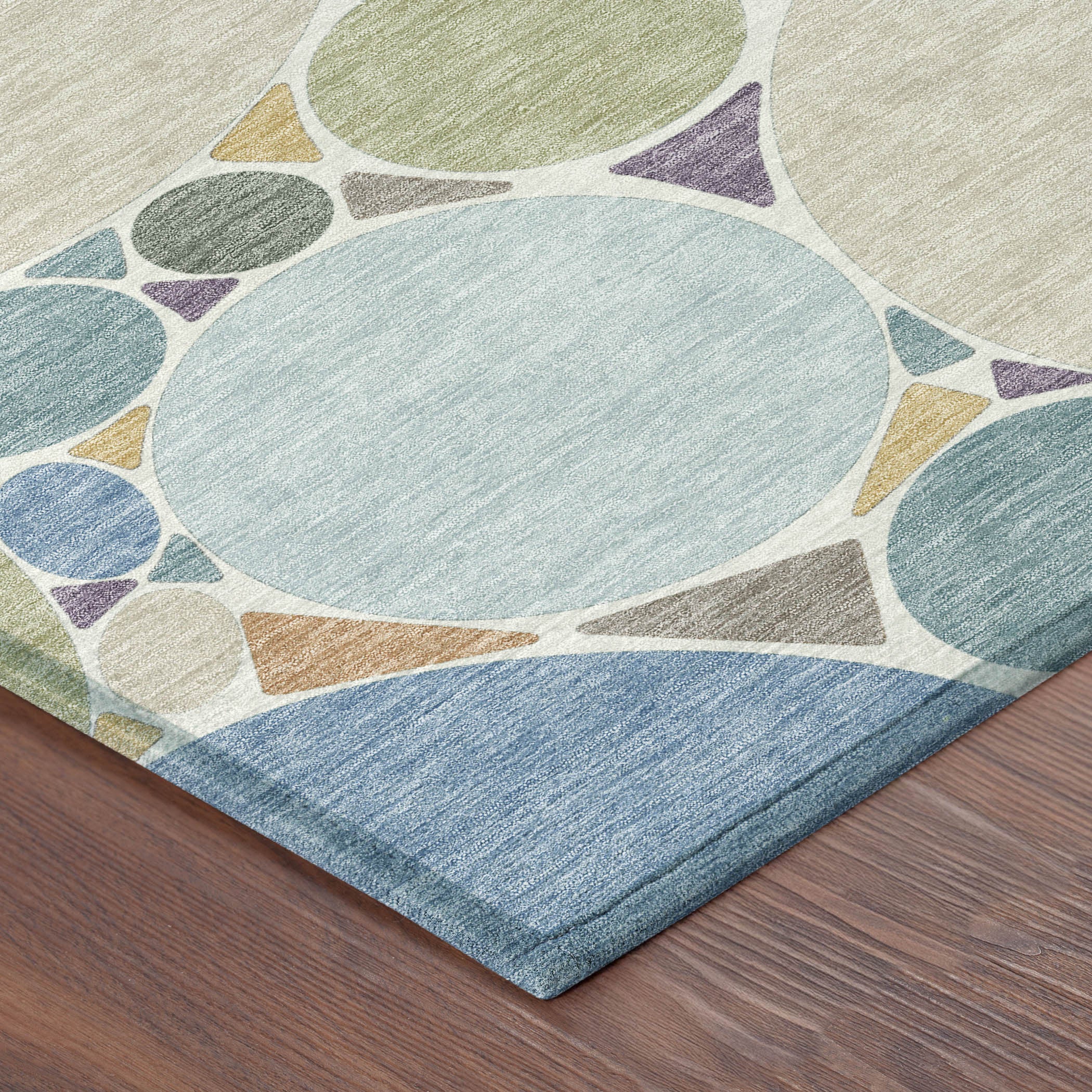 Blue and teal geometric area rug with circular pattern, washable indoor/outdoor