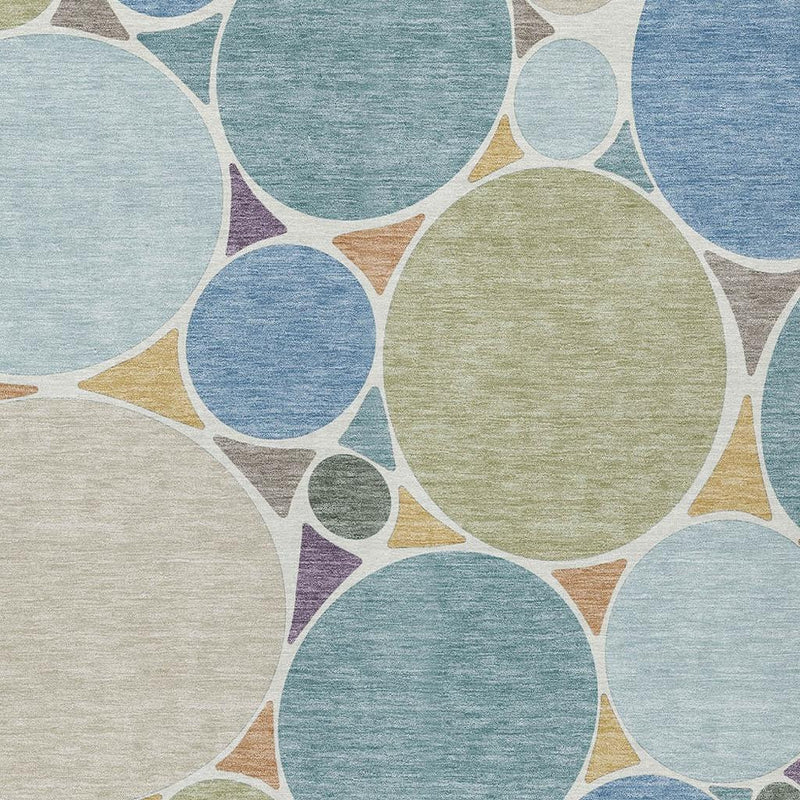 Light background geometric area rug with blue, teal, green, and purple circle pattern