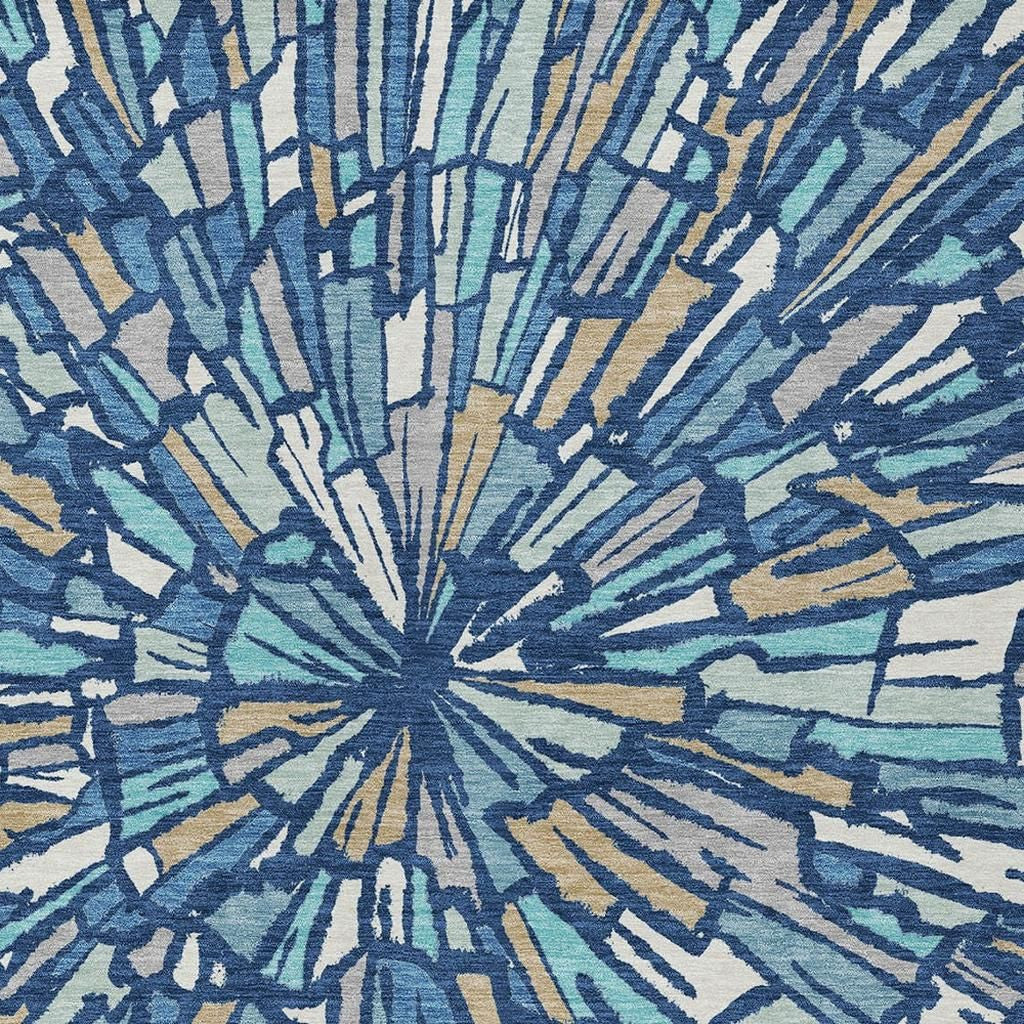 Textured look abstract navy and teal area rug with cream and gold radial lines