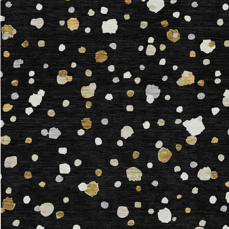 Black rug with dense white and gold abstract geometric speckles