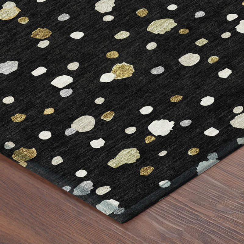Black area rug corner with white and gold speckled geometric design