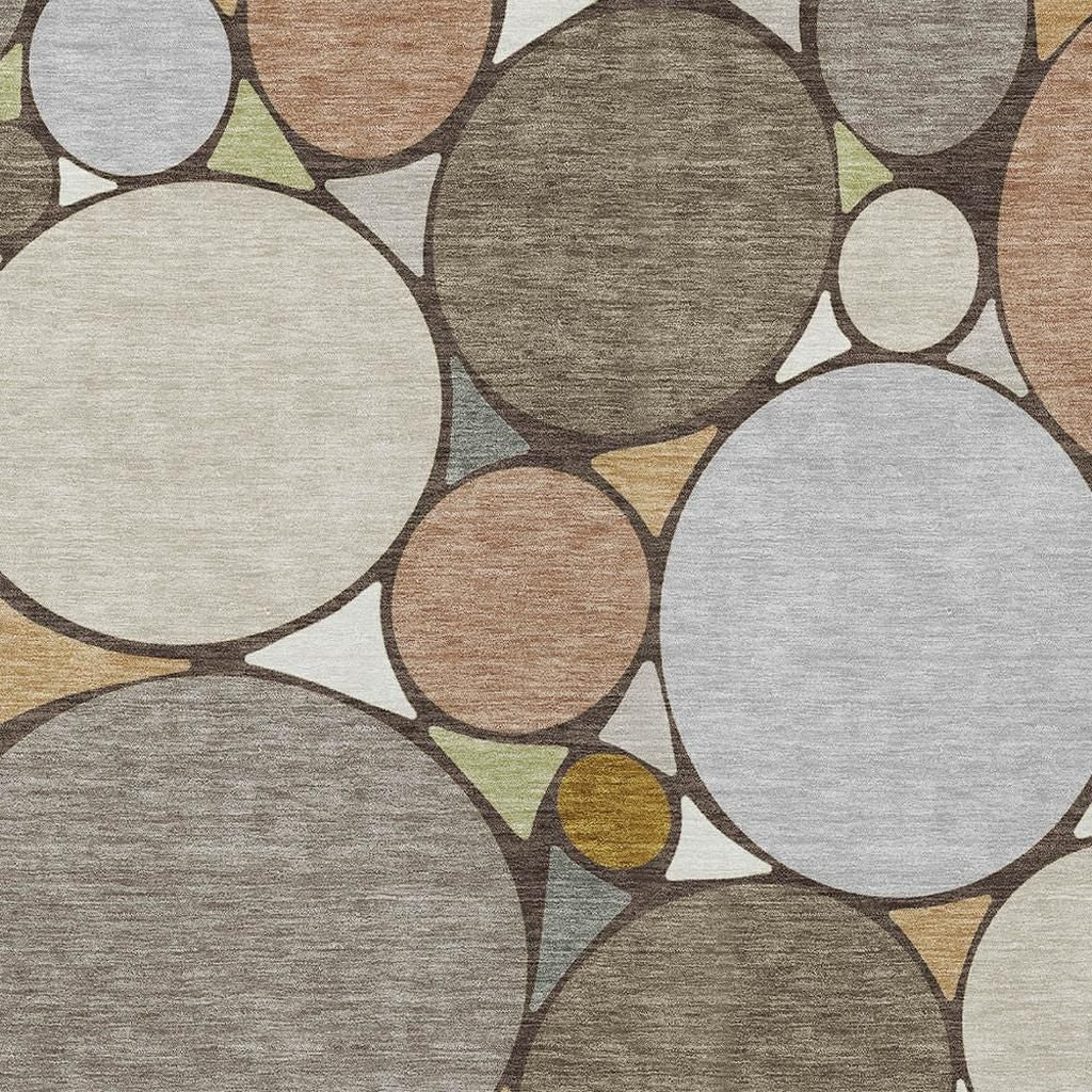 Taupe, beige, and cream geometric area rug with overlapping circle pattern