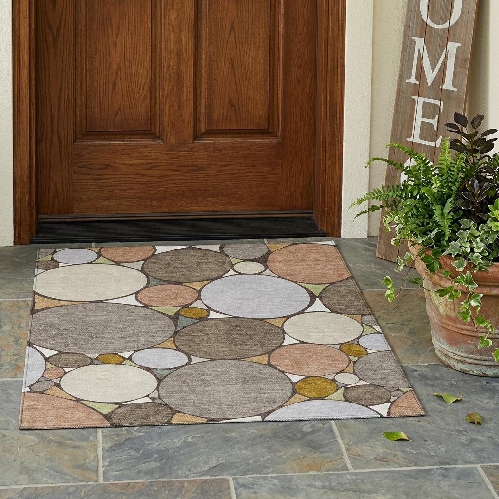 Outdoor-style geometric circle area rug with taupe, beige, and gray tones