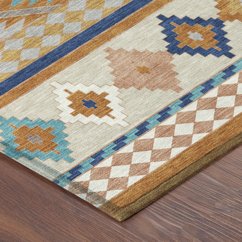 Southwestern rug corner detail with cream, orange, blue and tan zigzags and diamonds