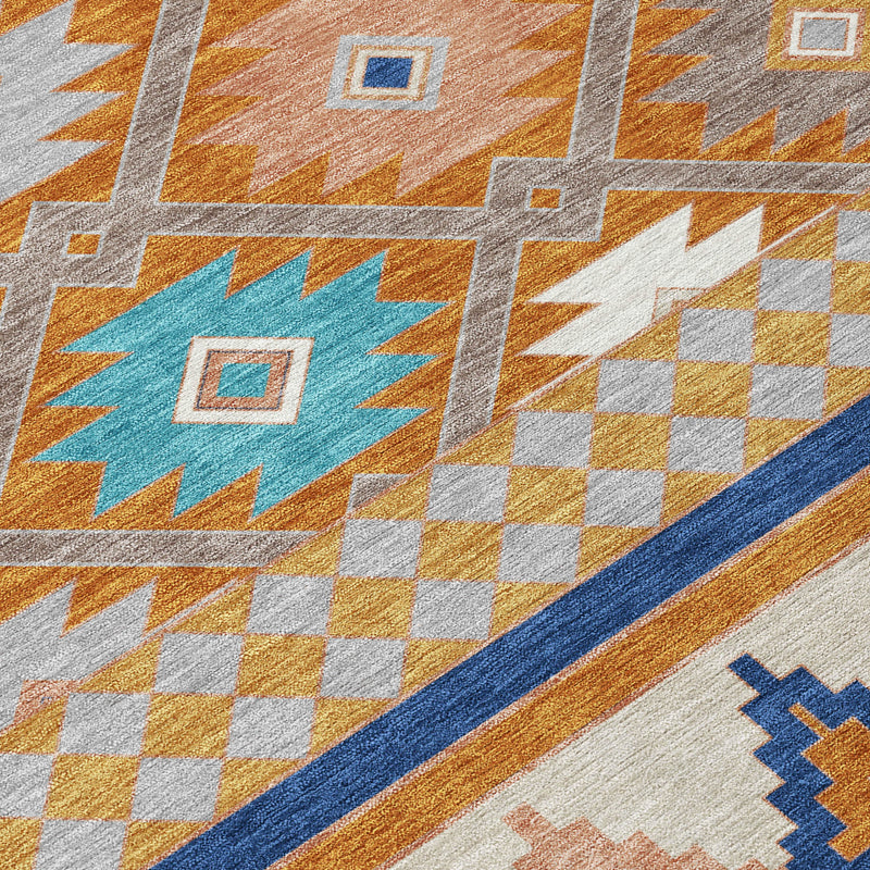 Southwestern rug close-up with orange, teal and white checker motifs and blue stripe
