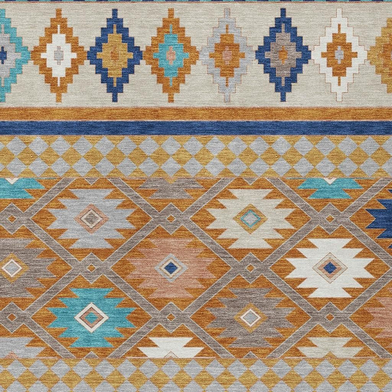 Southwestern area rug close-up with cream ground, blue and teal diamonds, orange accents