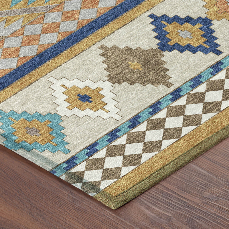 Rug corner detail with cream base, blue border, and gray-gold diamond and chevron motifs