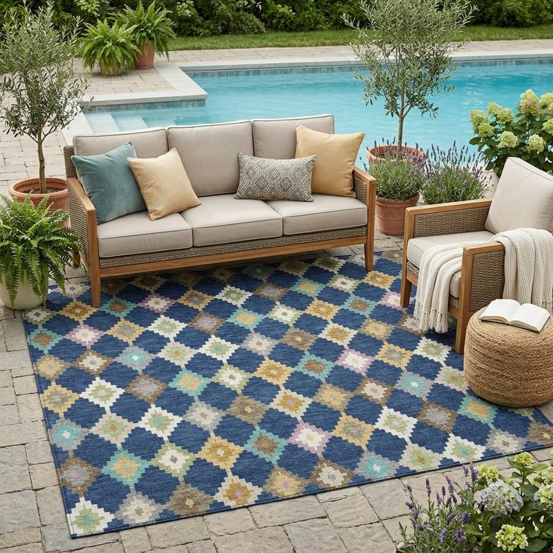Navy blue area rug with multicolor geometric diamond and zigzag pattern in cream, teal, gold
