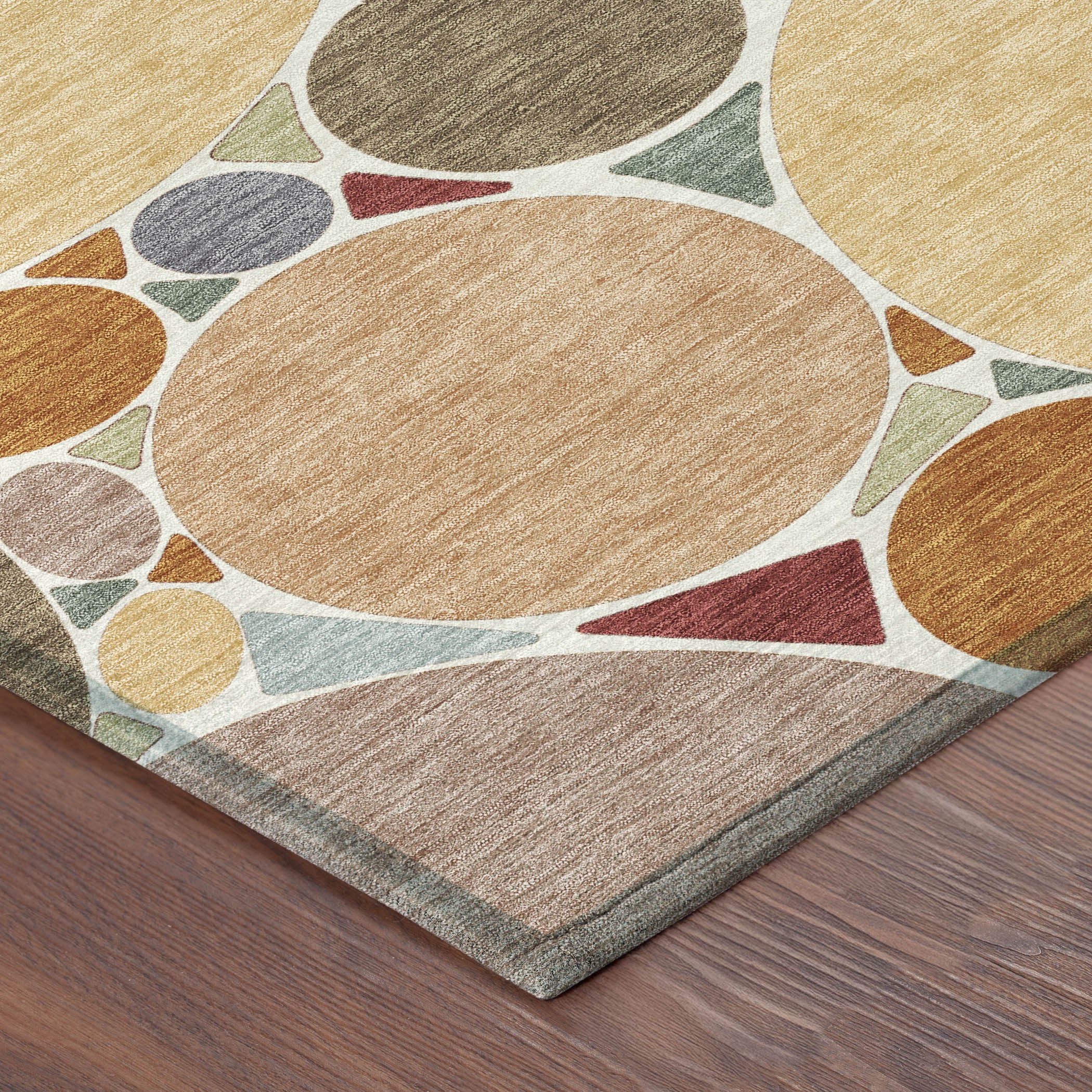 Geometric area rug with overlapping circles in orange, copper, gray, and cream