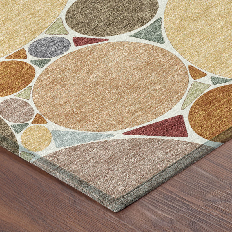 Geometric area rug with overlapping circles in orange, copper, gray, and cream