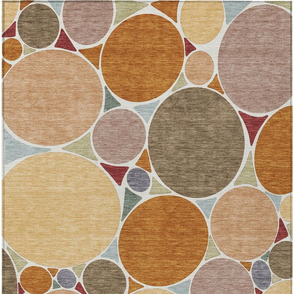 Geometric area rug, full pattern of overlapping circles in warm orange and muted pinks