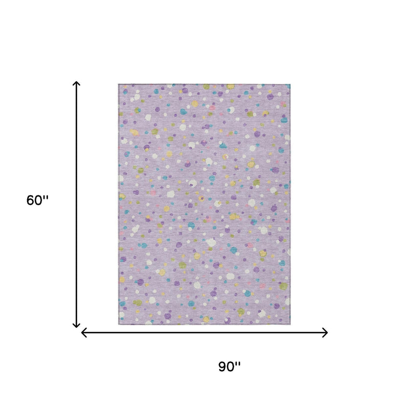 Lavender area rug flat view with multicolored geometric speckles and a thin light border