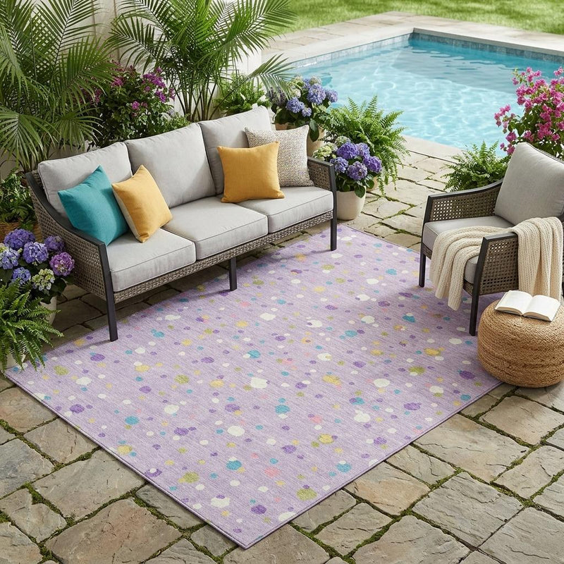 Lavender outdoor area rug with scattered multicolored geometric shapes and square edges