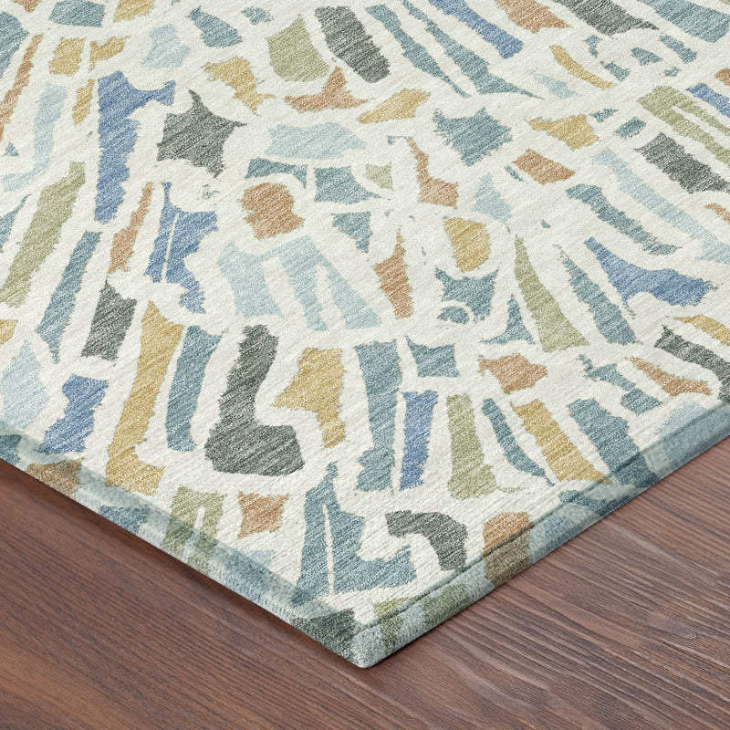 Corner view of abstract area rug with radial burst pattern and multicolor accents, flat edge