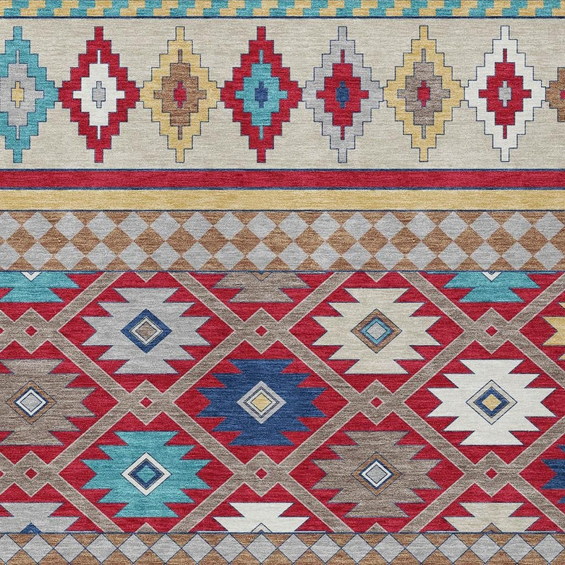 Close-up of southwestern area rug pattern with red, blue, teal, and ivory diamond medallions
