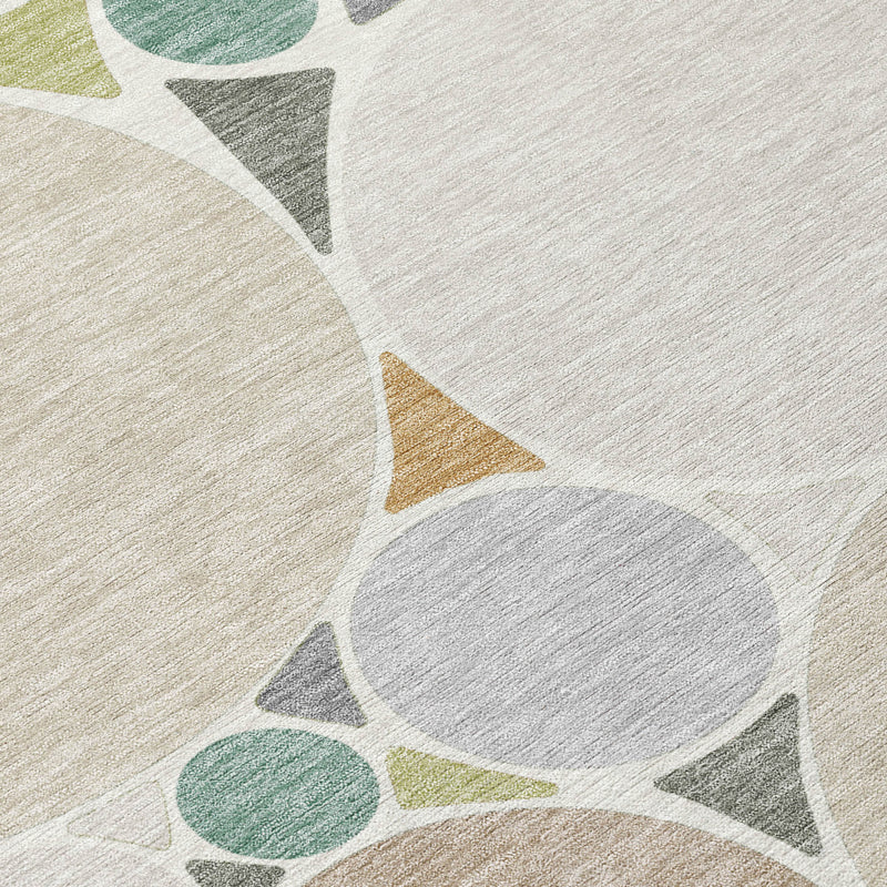 Beige, cream, and gray geometric rug detail with star and circle motifs in soft colors