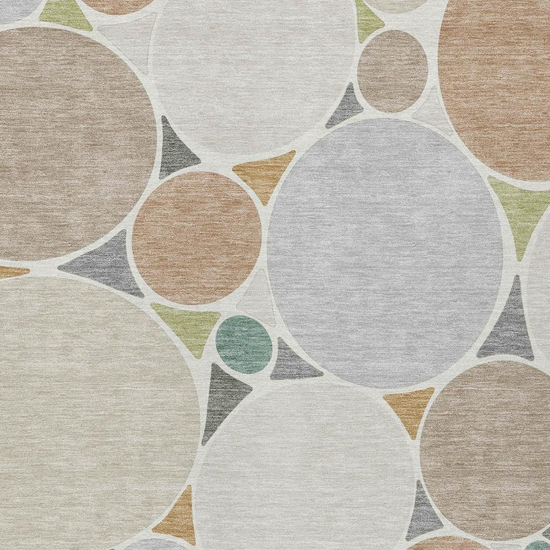 Geometric rug with large cream circle shapes, beige and gray tones, and small green dots