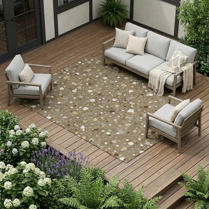 Brown and beige speckled area rug with abstract dot pattern and textured flat weave