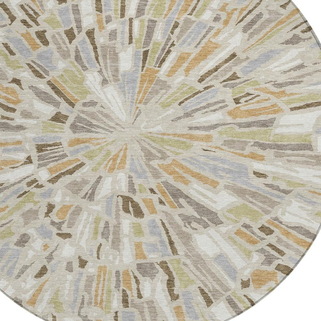 Beige, taupe, and gray round abstract area rug with radial burst pattern