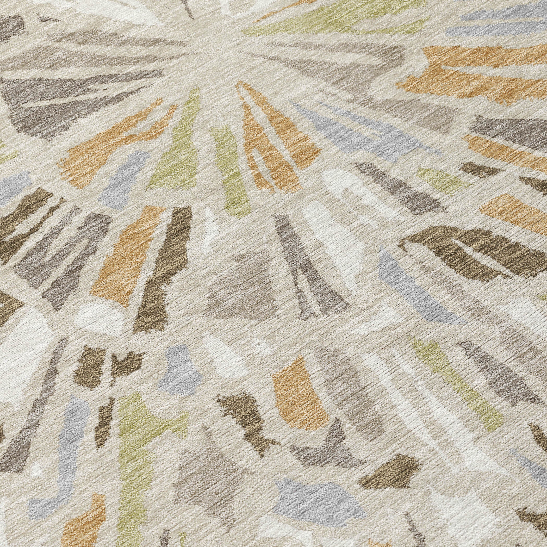 Close-up of beige, taupe, gray, and blue round abstract area rug pattern