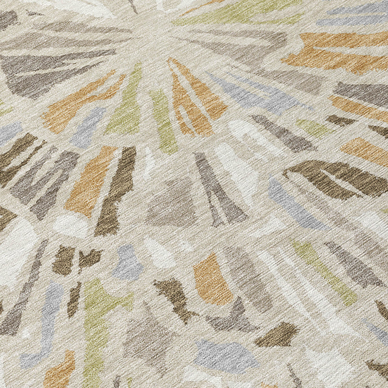 Close-up of beige, taupe, gray, and blue round abstract area rug pattern