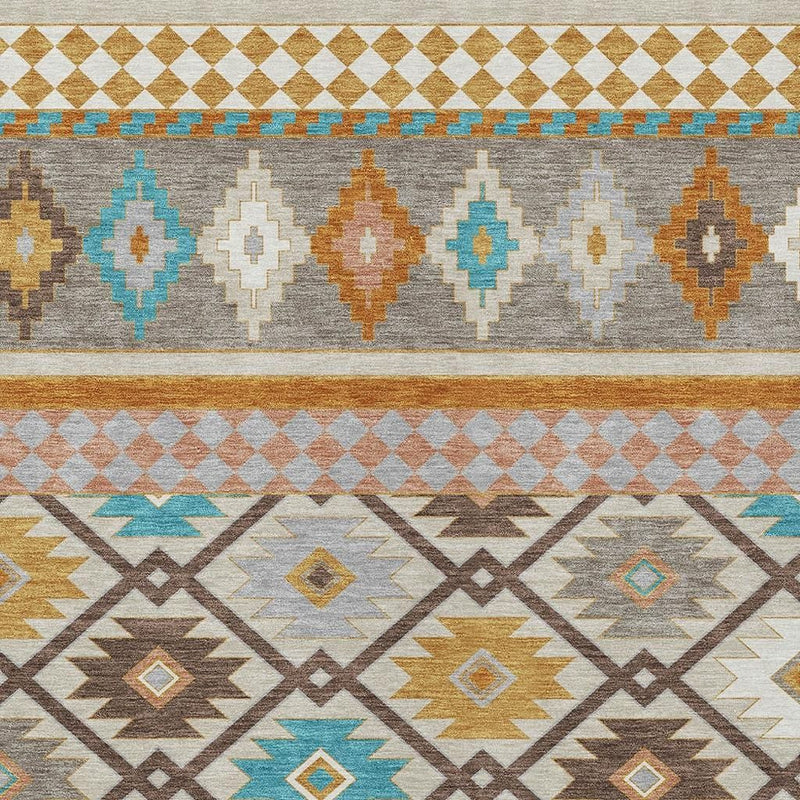 Southwestern area rug texture showing layered diamond and zigzag motifs in gray and tan