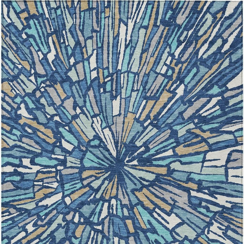Front view of abstract radial burst area rug with navy, teal, and tan accents
