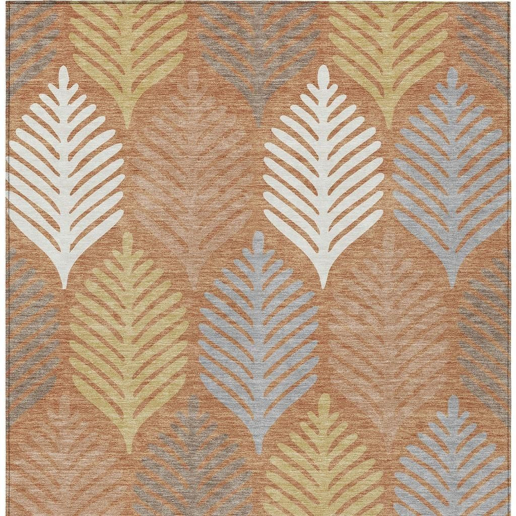 Orange and copper leaf pattern rug with cream and gray feather shapes