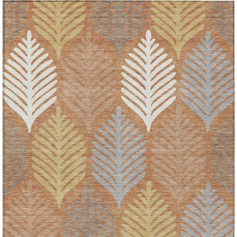 Orange and copper leaf pattern rug with cream and gray feather shapes