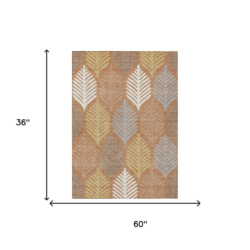 Area rug with orange-copper floral leaf pattern, 36 in x 60 in