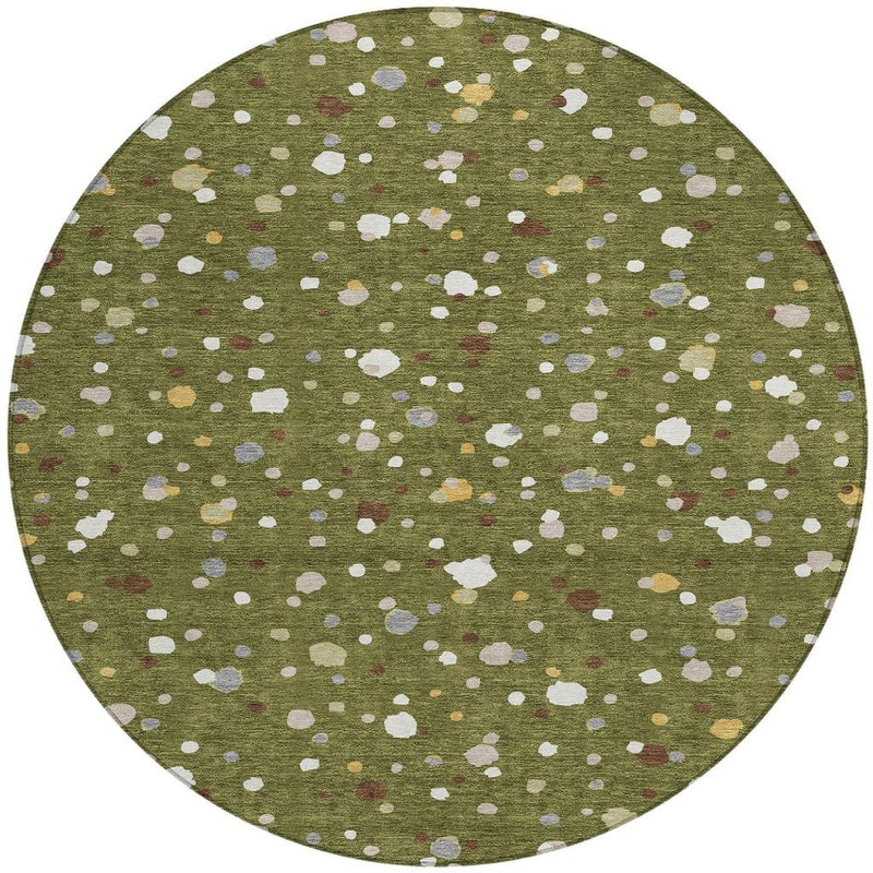 Round olive green area rug featuring scattered off-white and pale gray dots