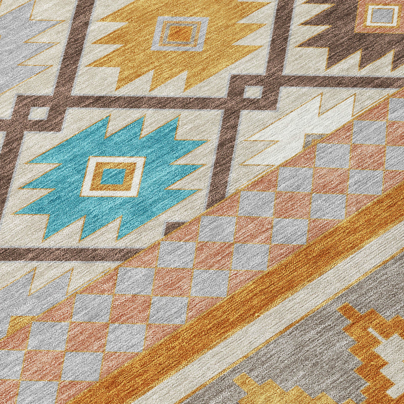 Southwestern area rug close-up with gray, orange, blue, and white geometric diamond pattern