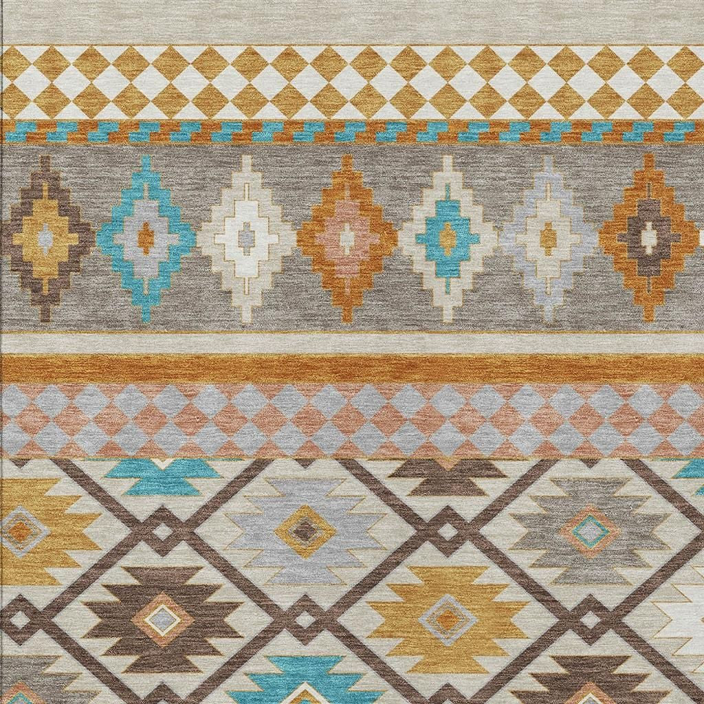 Geometric southwestern area rug with gray ground, tan border, and turquoise and orange motifs