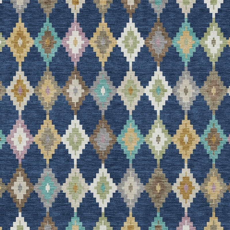 Close-up geometric diamond rug in navy blue with cream, tan, teal, and pink accents
