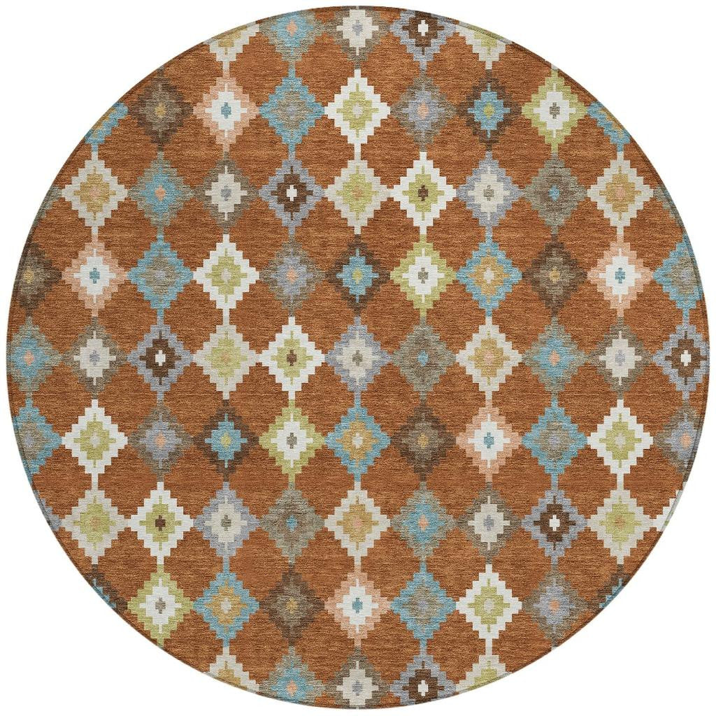 Round aztec rug with orange-brown, teal, gray, and cream geometric lattice pattern