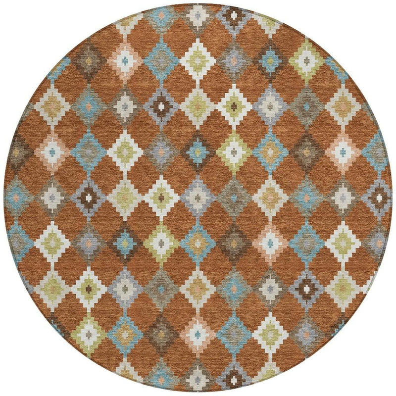 Round aztec rug with orange-brown, teal, gray, and cream geometric lattice pattern