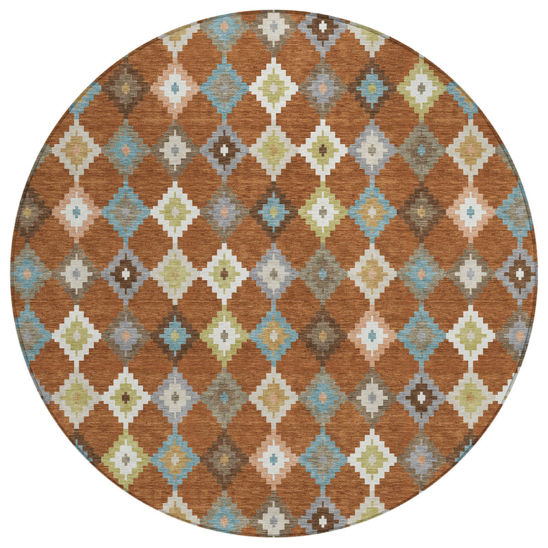 Round aztec rug with orange-brown background and teal, gray, and cream diamond shapes
