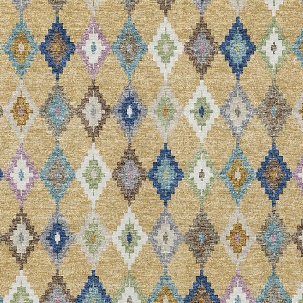 Aztec area rug pattern close-up, gold with teal blue and gray diamond shapes