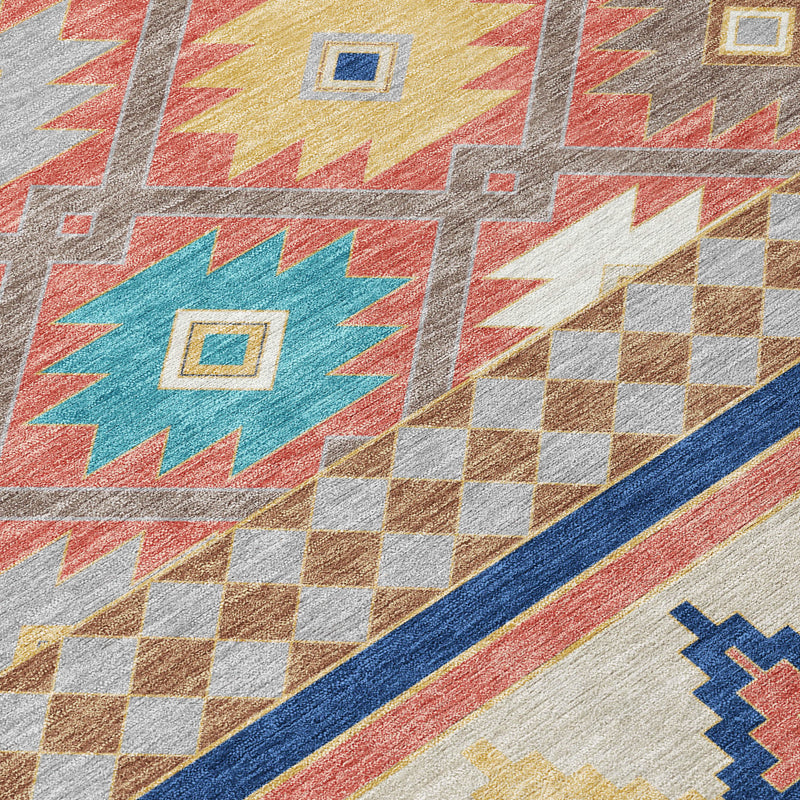 Geometric close-up of beige, coral, teal, and navy Southwestern rug border.