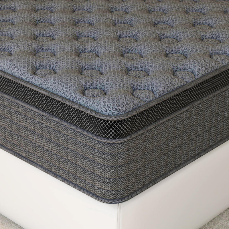 Dark gray hybrid mattress, tufted top and dark side panels with stitched border