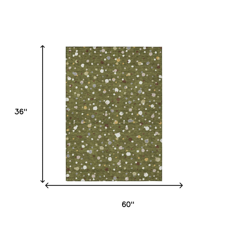 Olive green rug, 3 ft x 5 ft, with scattered white geometric specks