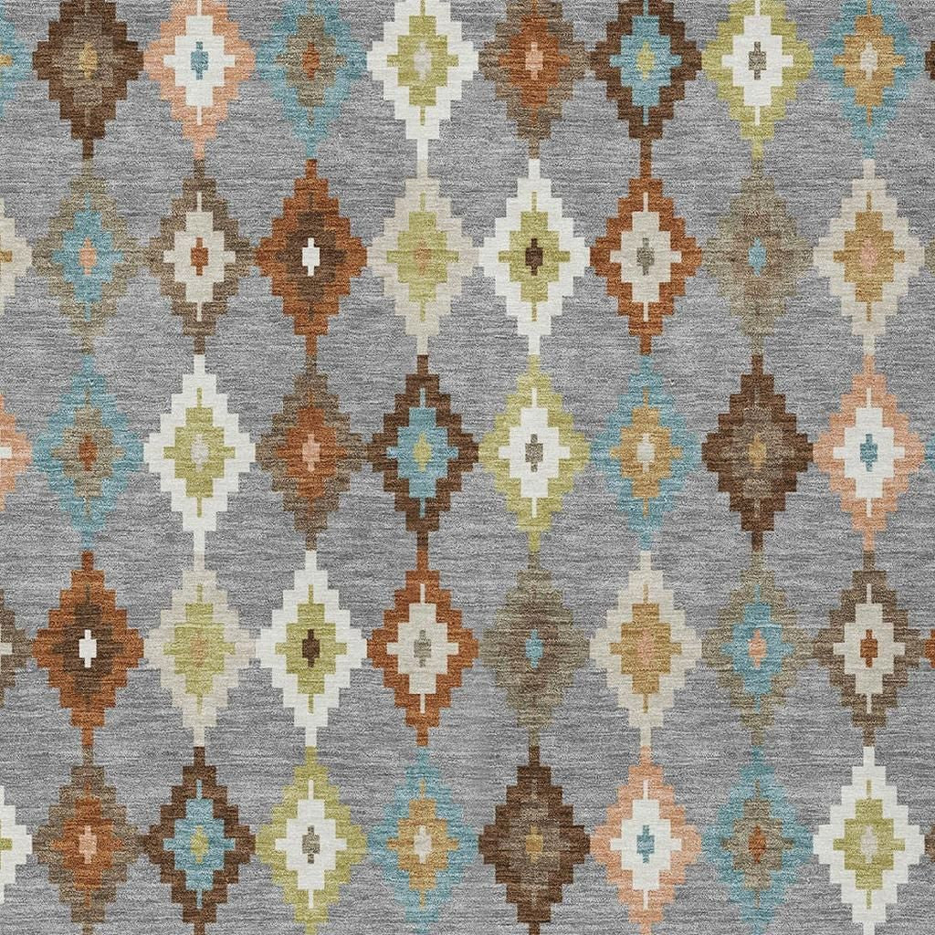 Gray geometric area rug with multicolor diamond rows in blue, tan, orange, and cream