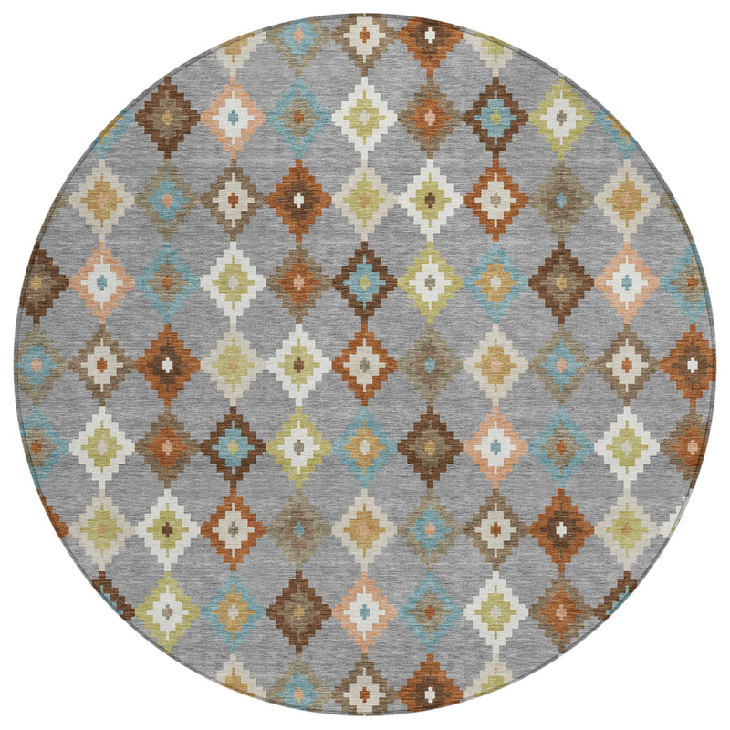 Round washable area rug featuring grey base with multicolor diamond Aztec motifs.