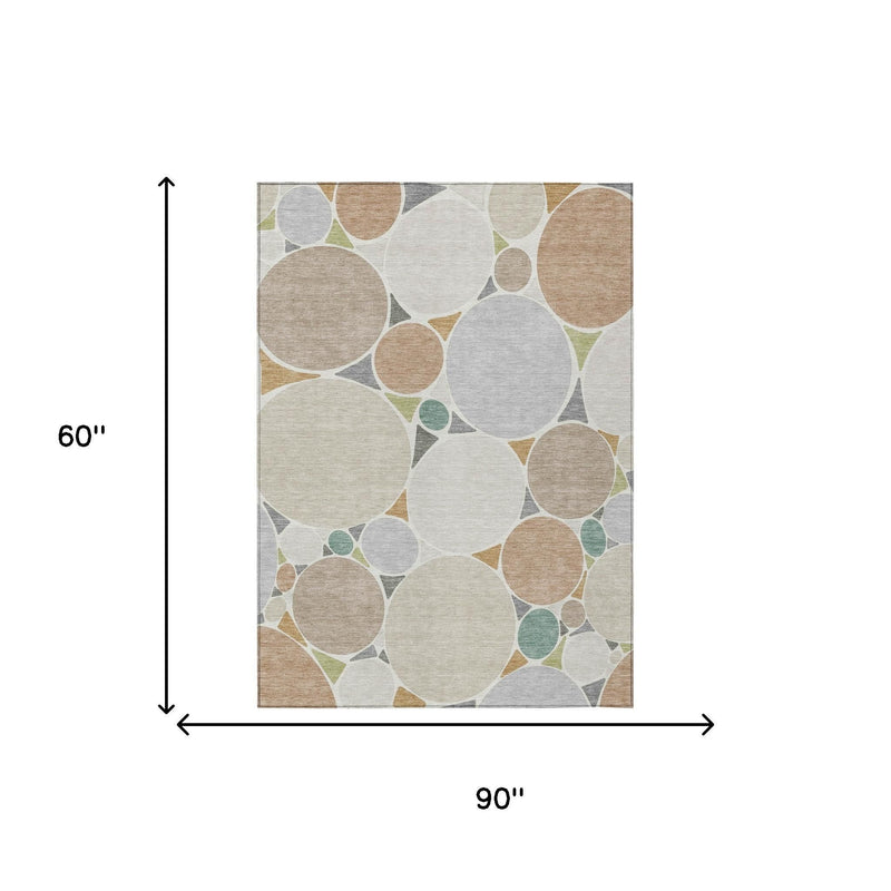 Beige and gray geometric area rug with circular motif, 60 x 90 in