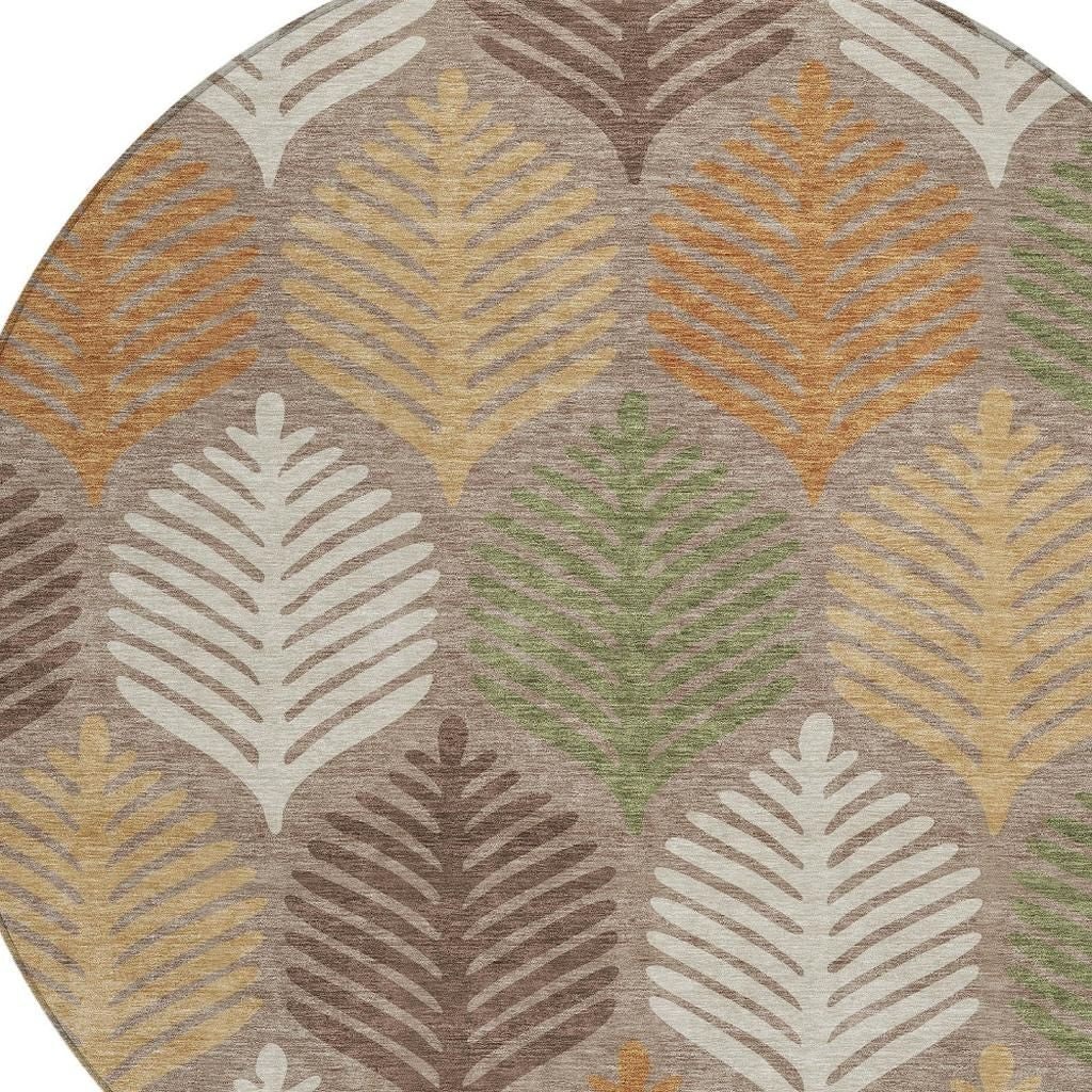 Round indoor/outdoor area rug close-up of multicolor leaf motifs and textured border