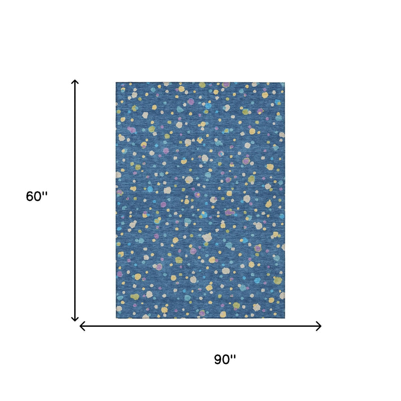 Rectangular navy blue area rug with multicolor geometric speckle pattern, 90 in by 60 in