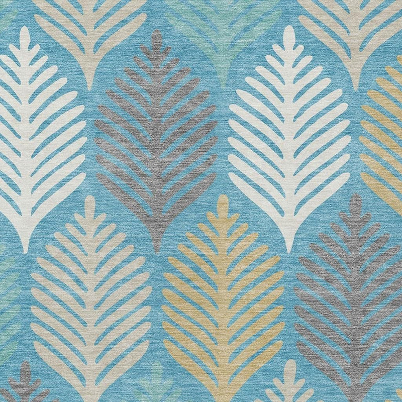 Teal blue area rug with repeating ivory leaf motifs, tight close-up.