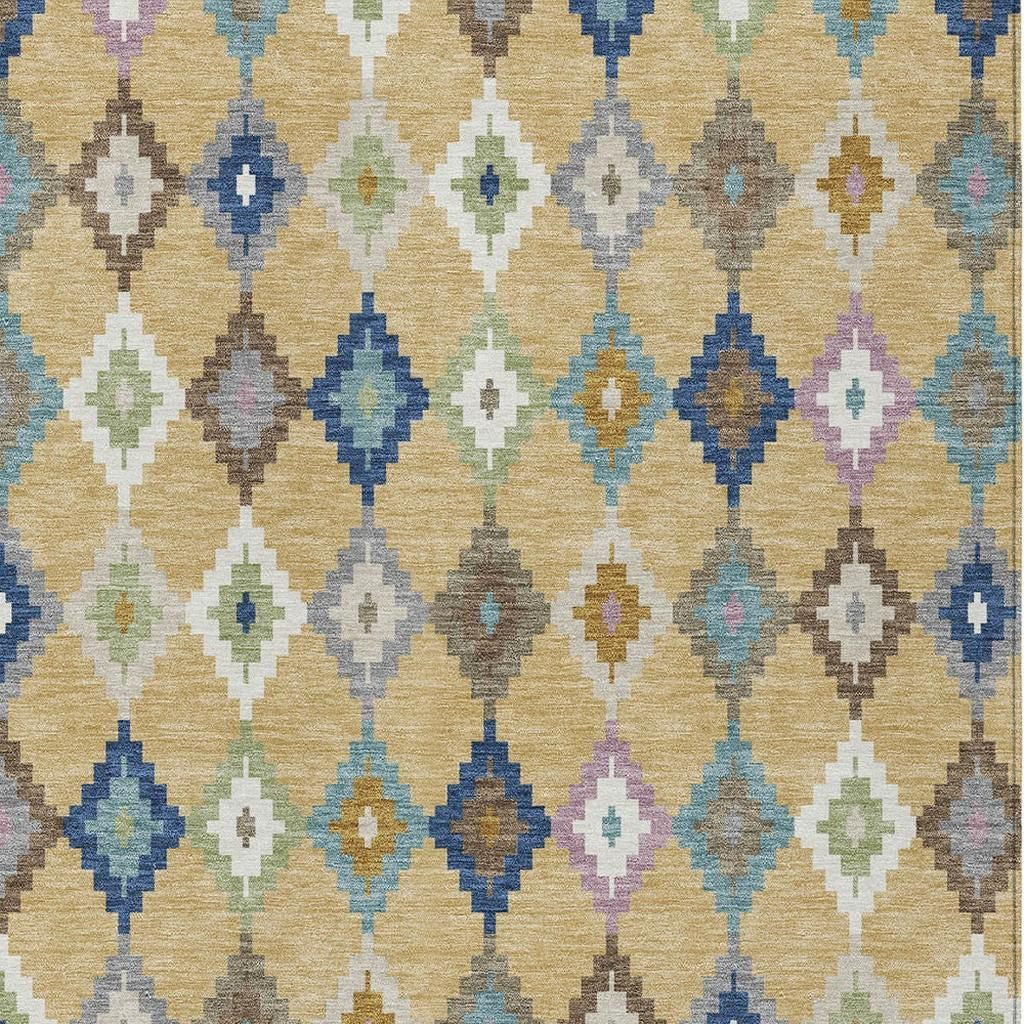 Tight close-up of indoor outdoor area rug with multicolor Aztec diamonds on gold background