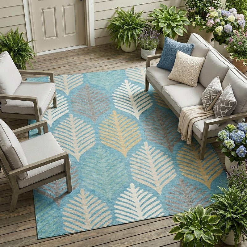 Teal blue area rug with repeating ivory and gold leaf fan motif pattern