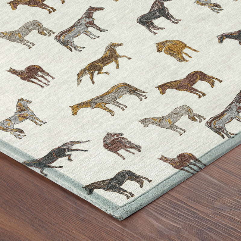 Ivory horse-pattern area rug corner with teal-edged border and multicolor horses